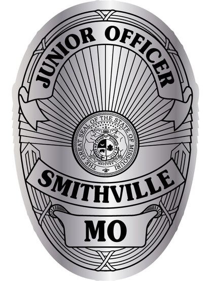 A silver and black badge design reading 'JUNIOR POLICE' and 911 with a central seal  
